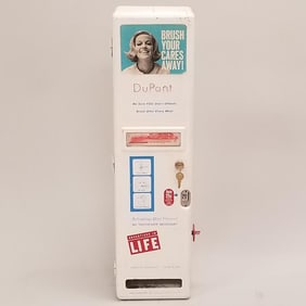 DuPont toothbrush 25 cent coin operated vending machine with toothbrushes- 31"H 9"W 4 1/2"D- working