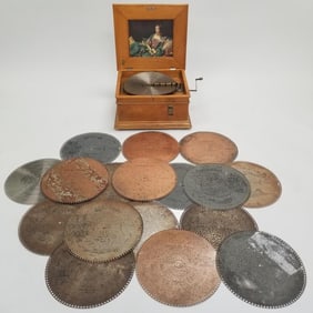 Regina disc coin operated music player with 18- 15" discs- 12 1/2"H 21"W 18 1/2"D- 72 lbs total-