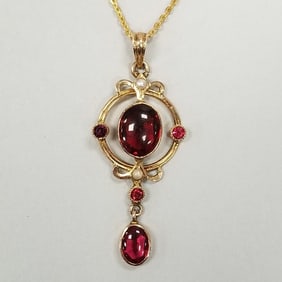 10K gold antique lavalier pendant necklace set with red stones: 2.6 grams, 1 3/8" pendant, 15" chain