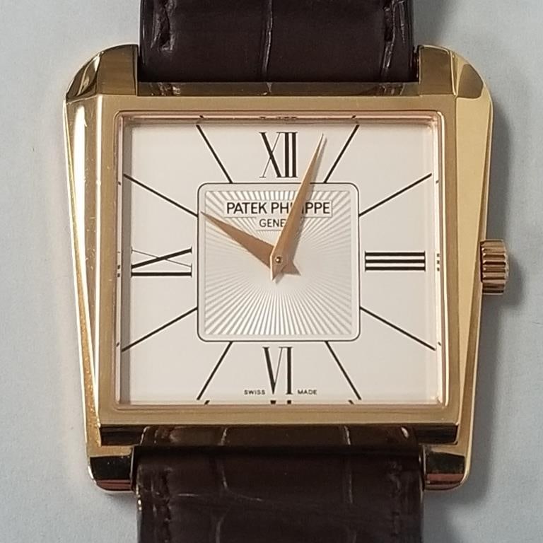 Patek Philippe 18K rose gold Gondolo Trapeze watch with original brown leather signed band and: Patek Philippe 18K rose gold Gondolo Trapeze watch with original brown leather signed band and buckle: reference #5489R with original hard case, product literature and outer box- one owner with copy o