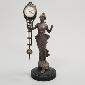 Junghans figural free swinging clock- 13 1/2"H 5"W