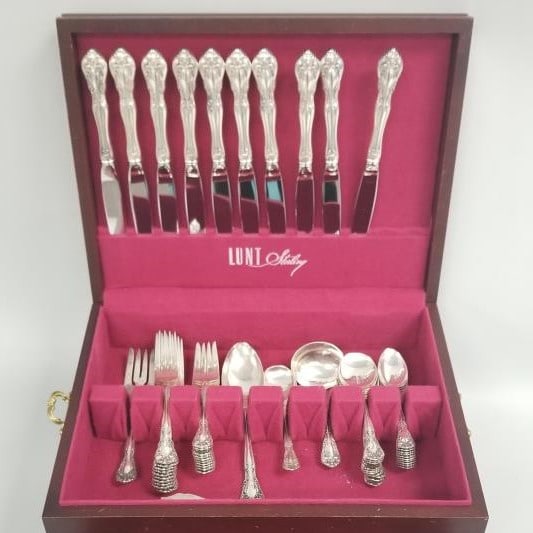 55 pieces Alvin Chateau Rose sterling silver flatware- 62 toz total- 9 1/2"L longest with a: 55 pieces Alvin Chateau Rose sterling silver flatware- 62 toz total- 9 1/2"L longest with a non-matching wood chest- 7 1/4"H 15 1/2"W 12 3/4"D