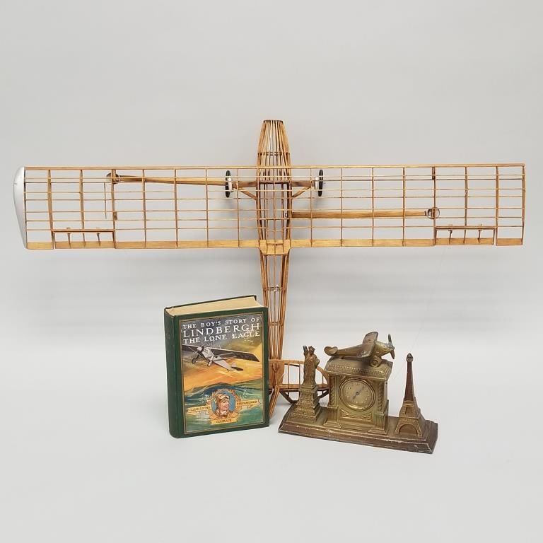 3 Spirit of St. Louis items: balsa wood frame model (some parts missing) 6 1/2"H 33 3/4"W 20 1/4"D,: 3 Spirit of St. Louis items: balsa wood frame model (some parts missing) 6 1/2"H 33 3/4"W 20 1/4"D, clock (as seen) & Lindbergh book