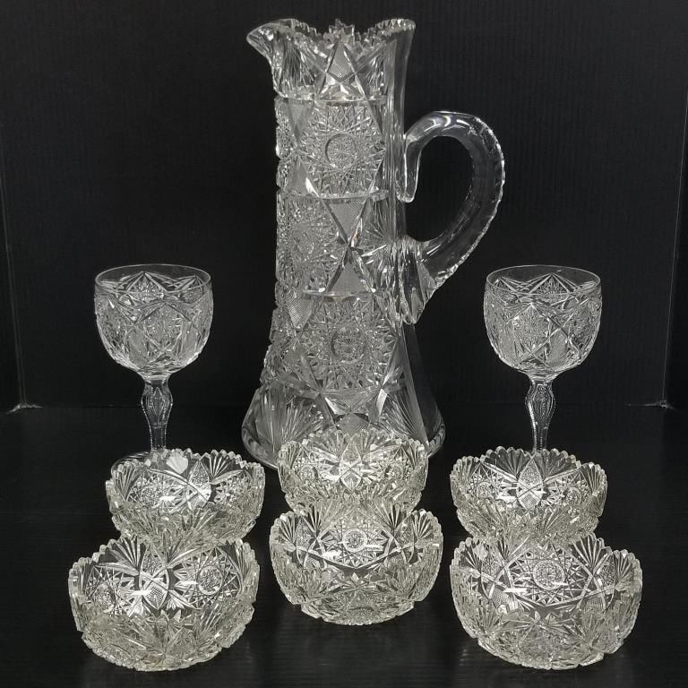 9 brilliant cut glass pieces: two- 6.5"H goblets, six- 4.5"D bowls (2 chipped); 14"H pitcher (chips) (1 of 20)