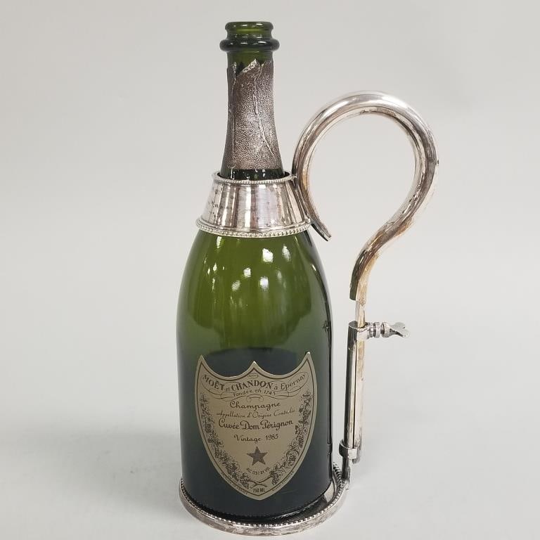Vintage adjustable silverplate wine bottle holder with Dom Perignon empty champagne bottle- 11 1/4"H: Vintage adjustable silverplate wine bottle holder with Dom Perignon empty champagne bottle- 11 1/4"H 5 1/2"W 4"D assembled O.D.