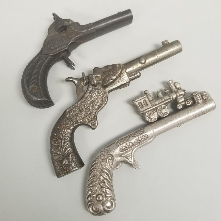 3 small cast iron toy guns: train, 1880 double barrel & lion- 2 1/2"H 5 1/4"L largest: 3 small cast iron toy guns: train, 1880 double barrel & lion- 2 1/2"H 5 1/4"L largest