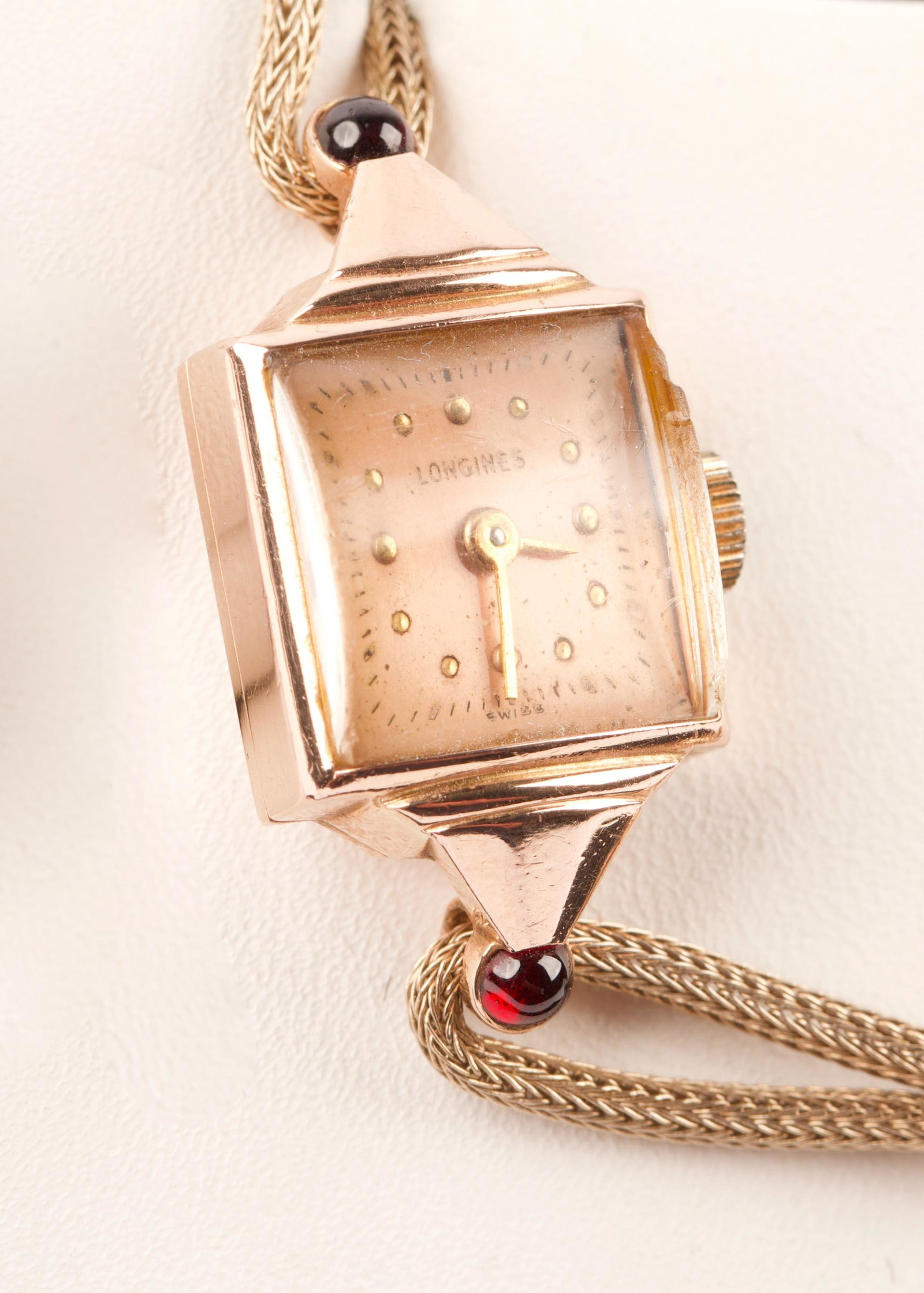 c1930s Longines Ladies Wrist Watch: Circa 1930s Longines14K Gold Ladies Wrist Watch with Baume and Mercier Movement and 2 Round Cabachon Ruby Gemstones, Rolled Gold Foxtail Link Bracelet Working Condition, Weight 11.4g, Watch Size 3.0cm