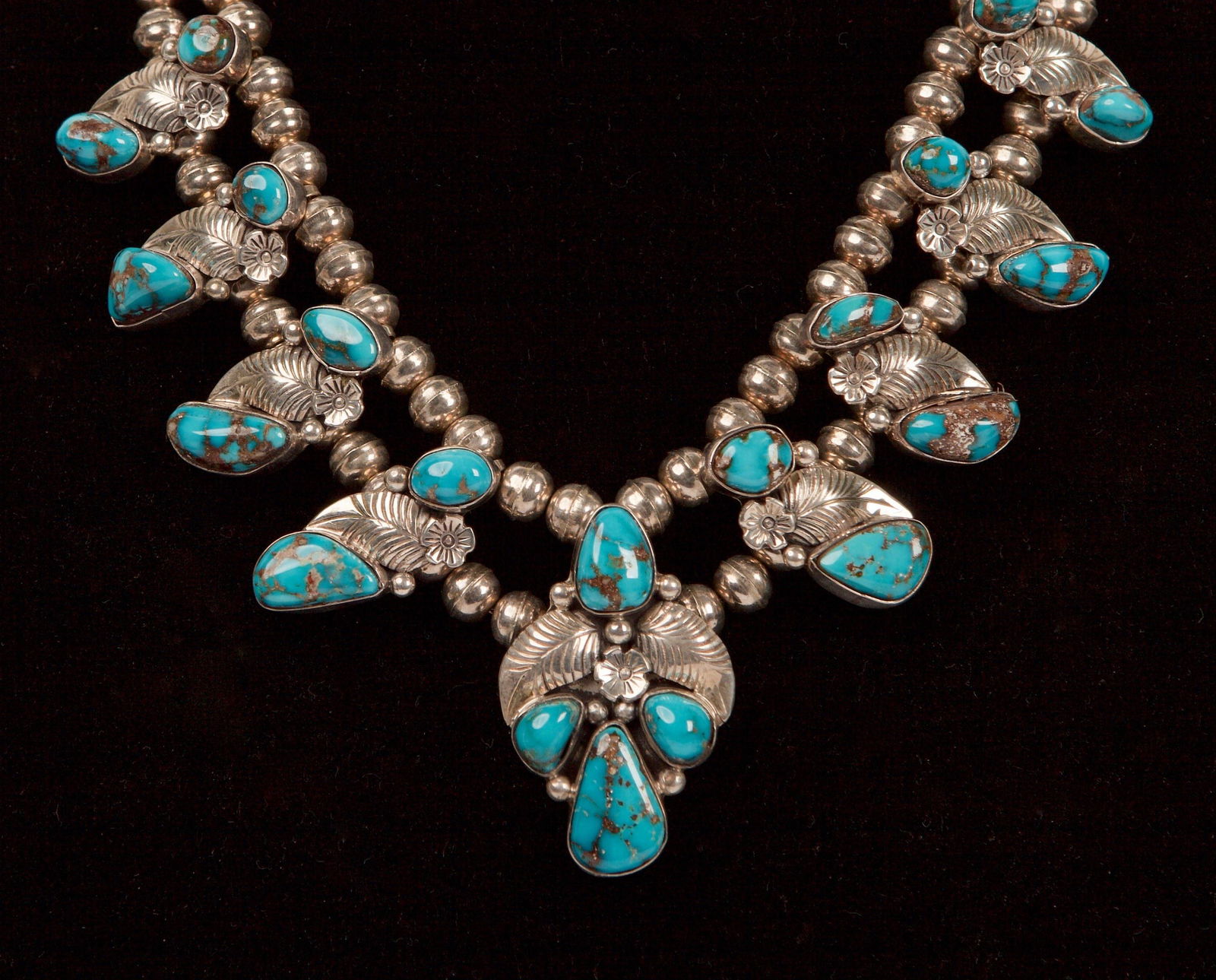 Sterling & Turquoise Navajo Squash Blossom Necklace: Sterling Silver & Turquoise Navajo Squash Blossom Necklace, Stamped "DR STERLING" Weight 77.6gm, Length 50cm incl. VALUATION CERTIFICATE of $2,500.00 One ladies hand crafted Native American lndian Nav
