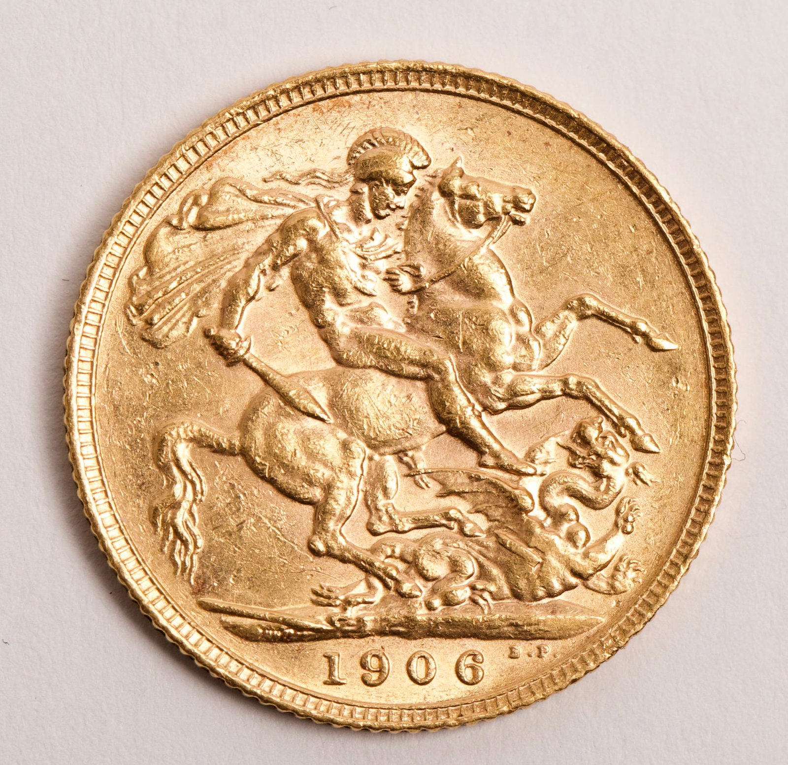 1906 St. George & Dragon 22K Gold Sovereign: 1906 St. George & Dragon 22K Gold Sovereign, Minted in London Weight 7.98g, Gold Purity 7.31g, Grade Fine