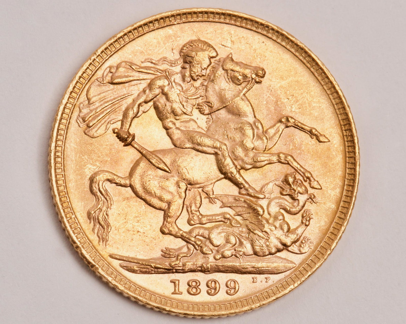 1899 St. George & Dragon 22K Gold Sovereign: 1899 St. George & Dragon 22K Gold Sovereign, Minted in Melbourne Weight 7.98g, Gold Purity 7.31g, Grade Extra Fine