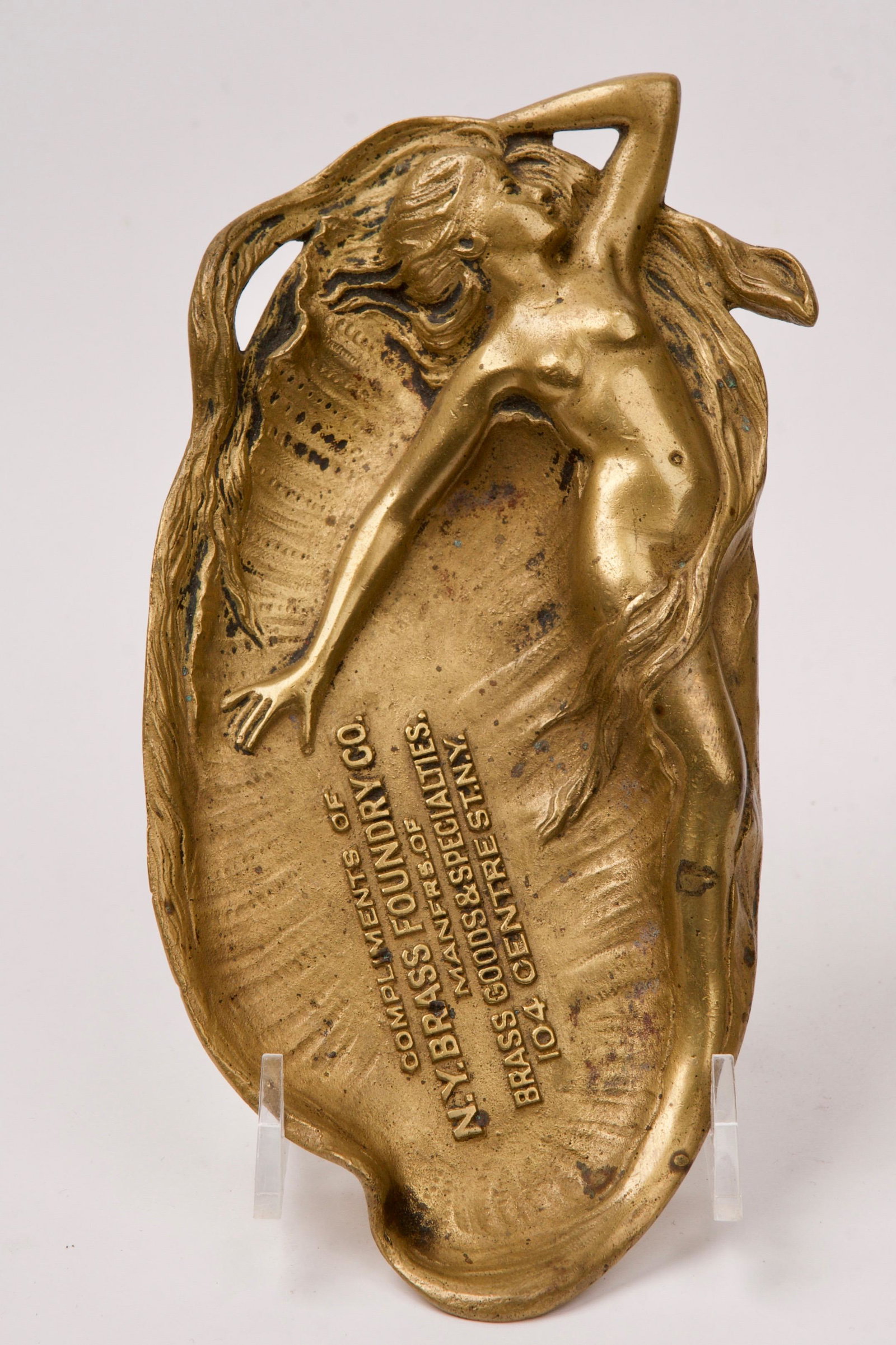 Art Nouveau New York Brass Foundry Promotional Paper Weight: Made by N.Y. Brass Foundry Co. Manufacturers of Brass Goods and Specialties, then of 104 Centre Street, New York Quantity: 1 Condition: Good Creator: N.Y. Brass Foundry Co. Origin: America