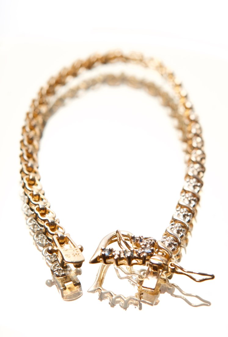 Sterling Silver Vermeil Bracelet with Heart Shaped Charm: with Blue and White Stones Quantity: 1 Condition: Needs a Clean Weight: 8.5g or approximately 0.3oz Materials: Sterling Silver (.925) Item location: NSW, Australia