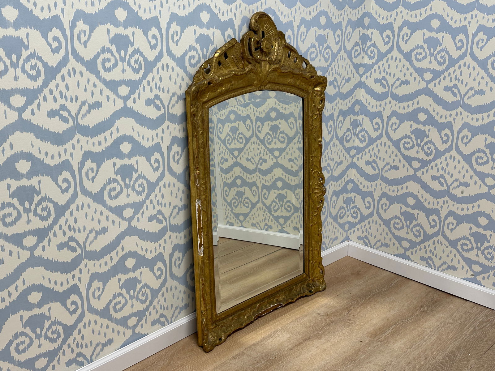 Antique Gilded Ballroom Mirror: 30in w x 49in h x 2in d. Frame has significant breakage especially around the corners. In need of professional restoration. Exceptional workmanship.