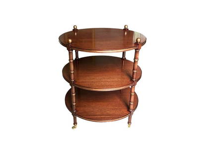 Round 3-Tier Table with Gold Details and Brass Casters: 24 in. diameter x 27.5 in. h. PLEASE READ BEFORE PLACING A BID: Pickup for this auction will take place at a private residence in Rye, NY on Friday, July 25th, from 9:00 AM to 12:00 PM, and Saturday,