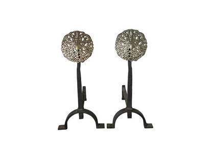 Arts and Crafts Andirons with Brass Filigree Top and Wrought Iron Bases: 11 in. w x 24 in. d x 16 in. h. PLEASE READ BEFORE PLACING A BID: Pickup for this auction will take place at a private residence in Rye, NY on Friday, July 25th, from 9:00 AM to 12:00 PM, and Saturday