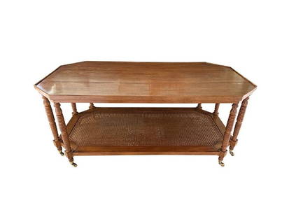 Turned-Leg Wood and Cane Coffee Table: 54 in. w x 30 in. d x 22 in. h. PLEASE READ BEFORE PLACING A BID: Pickup for this auction will take place at a private residence in Rye, NY on Friday, July 25th, from 9:00 AM to 12:00 PM, and Saturday
