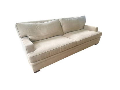 Kravet Beige Sofa with Down Filled Back Pillows: 97 in. w x 44 in. d x 34 in. h, Seat height: 18 in., Arm height: 24 in. Reupholstery recommended, see photos. Has light sunfading and noticeable pulls in fabric. PLEASE READ BEFORE PLACING A BID: Pick