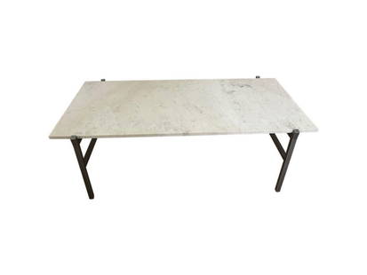 CB2 Marble and Metal Cocktail Table: 43 in. w x 22 in. d x 14 in. h. Marble top has slight patina due to normal wear, see photos. PLEASE READ BEFORE PLACING A BID: Pickup for this auction will take place at a private residence in Rye, NY