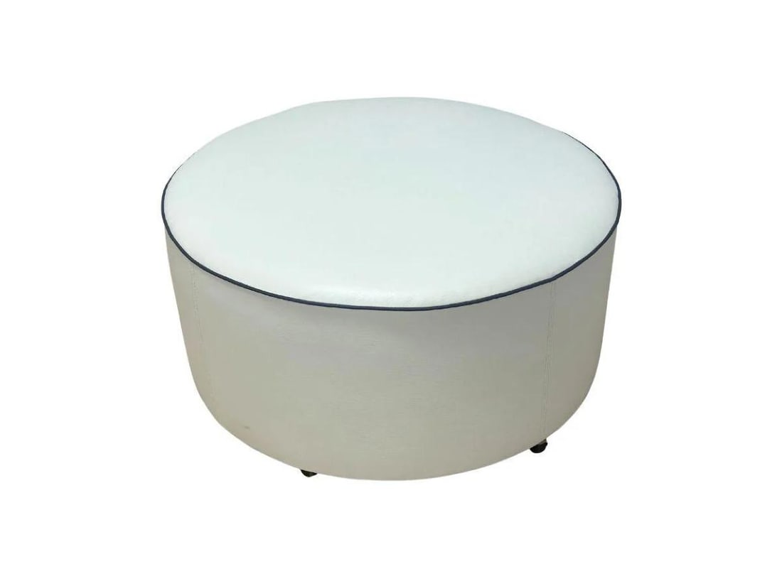 Chaddock Leather Ottoman on Casters: White with blue piping. 36 in. diameter x 18 in. h. A few of the casters need to be reattached, see photos.