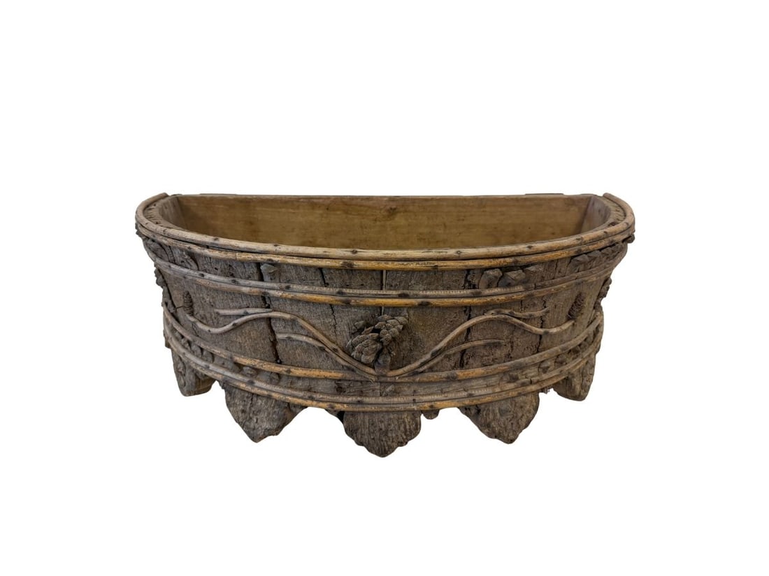 Rustic Jardiniere on Wheels: 28in.w x 14in.d x 10in.h, bark & pinecone details. PLEASE READ BEFORE BIDDING: There are two scheduled pickup dates for this auction at our Stamford, CT warehouse: Friday, March 20th from 9:00