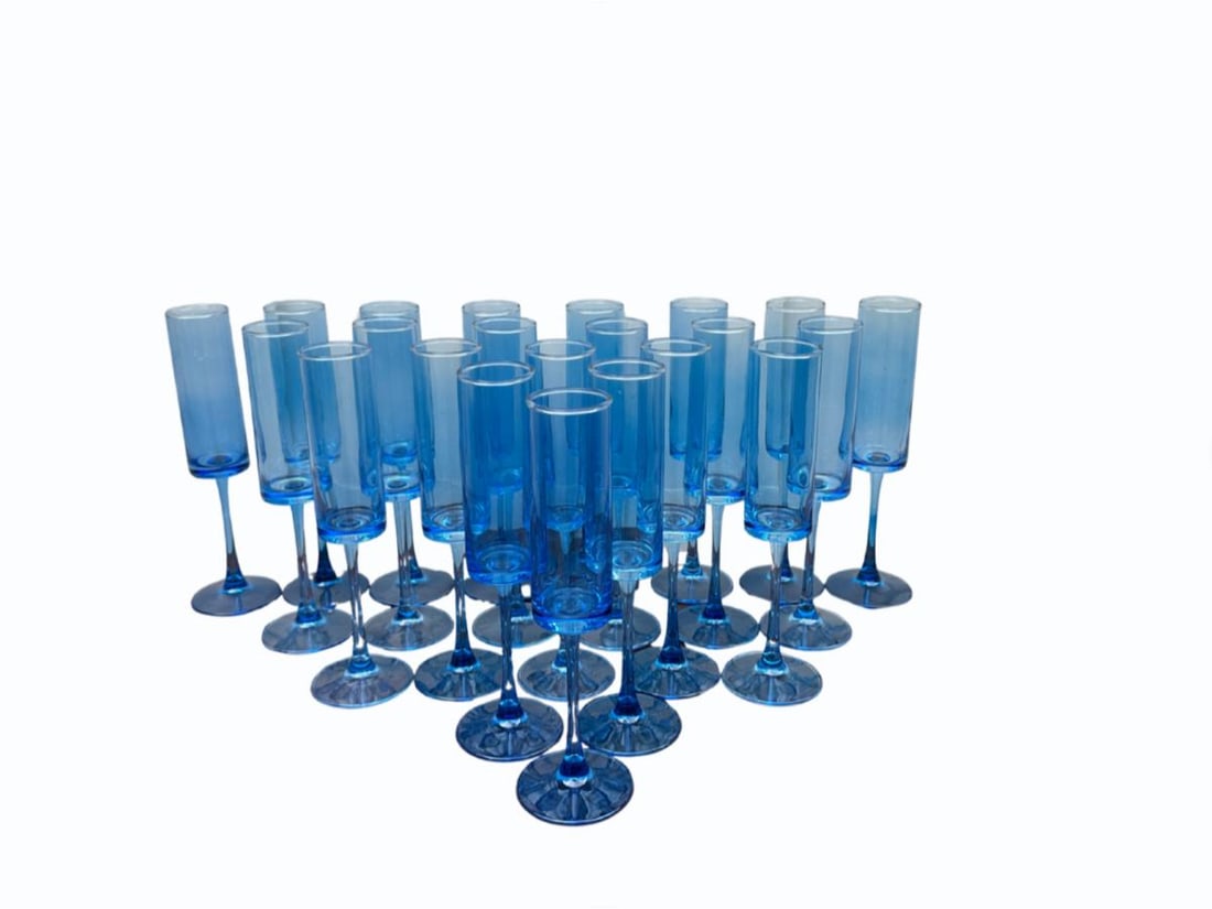 Blue Champagne Flutes, Set of 22: 3in. diameter x 10in. h. PLEASE READ BEFORE BIDDING: There is only one scheduled pickup date for this auction on Friday, June 5th from 9am- 12pm at a private residence in Rye, NY. The address will be