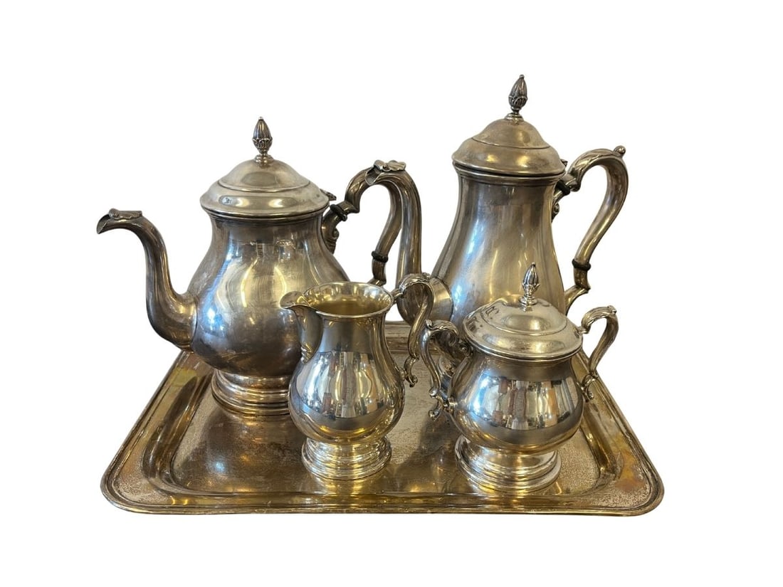 Sterling Silver Coffee and Tea Set: Coffee pot, 9.5 in w x 5 in d x 10.5 d. Tea pot, spout to handle 10.25 in x 6 in deep x 9.25 in h. Sugar, 6 in w x 4 in d x 6.25 h. Creamer, 4.25 in w x 3.5 in d x 5.25 in h. Tray, 15 in w x 11 in d