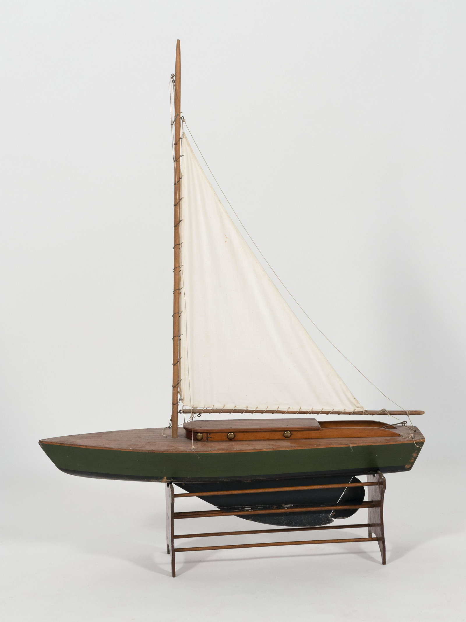 POND MODEL Green and black wooden hull. Cotton sails.: POND MODEL Circa 1890 Green and black wooden hull. Cotton sails. Height 47". Length 33".
