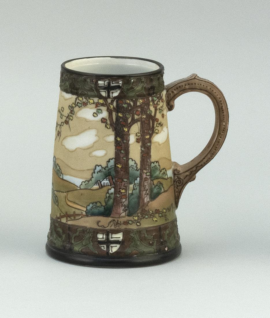 NIPPON PORCELAIN MUG In modified cylindrical form, with: NIPPON PORCELAIN MUG In modified cylindrical form, with landscape design bordered by heraldic shields. Van Patten #47 mark on base. Height 5.5".