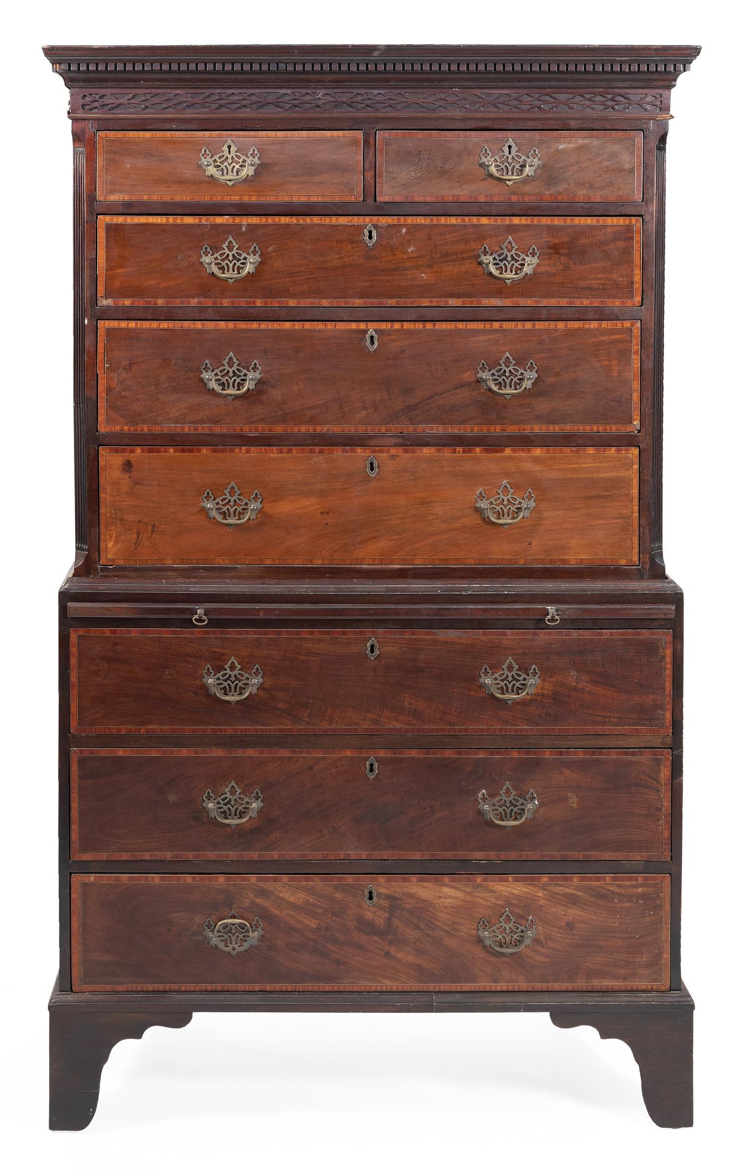 ENGLISH CHEST-ON-CHEST In walnut and walnut veneer.: ENGLISH CHEST-ON-CHEST Last Quarter of the 18th Century In walnut and walnut veneer. Upper case with a dentil-molded cornice and applied openwork molding over two half drawers and three full-width dra