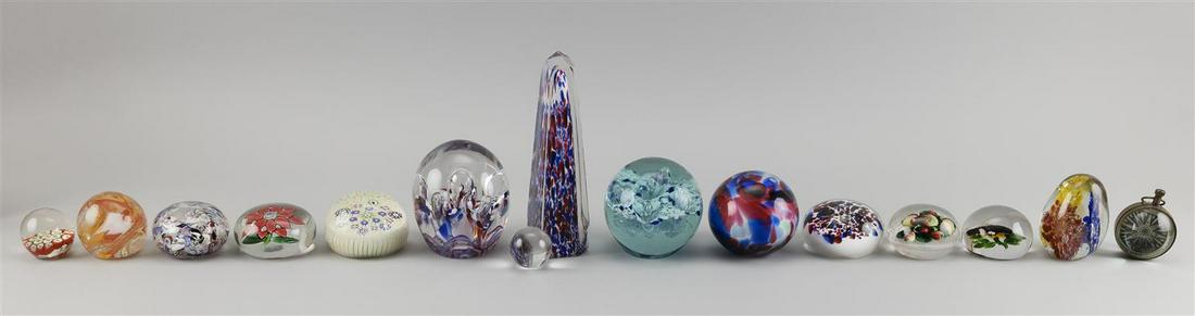FIFTEEN GLASS OBJECTS 1-12) Twelve paperweights,: FIFTEEN GLASS OBJECTS 1-12) Twelve paperweights, including several Sandwich and one Scottish. Largest height 7.5". 13) Clear marble. 14) Hollow blue and red orb. 15) Clock encased in glass. Provenance