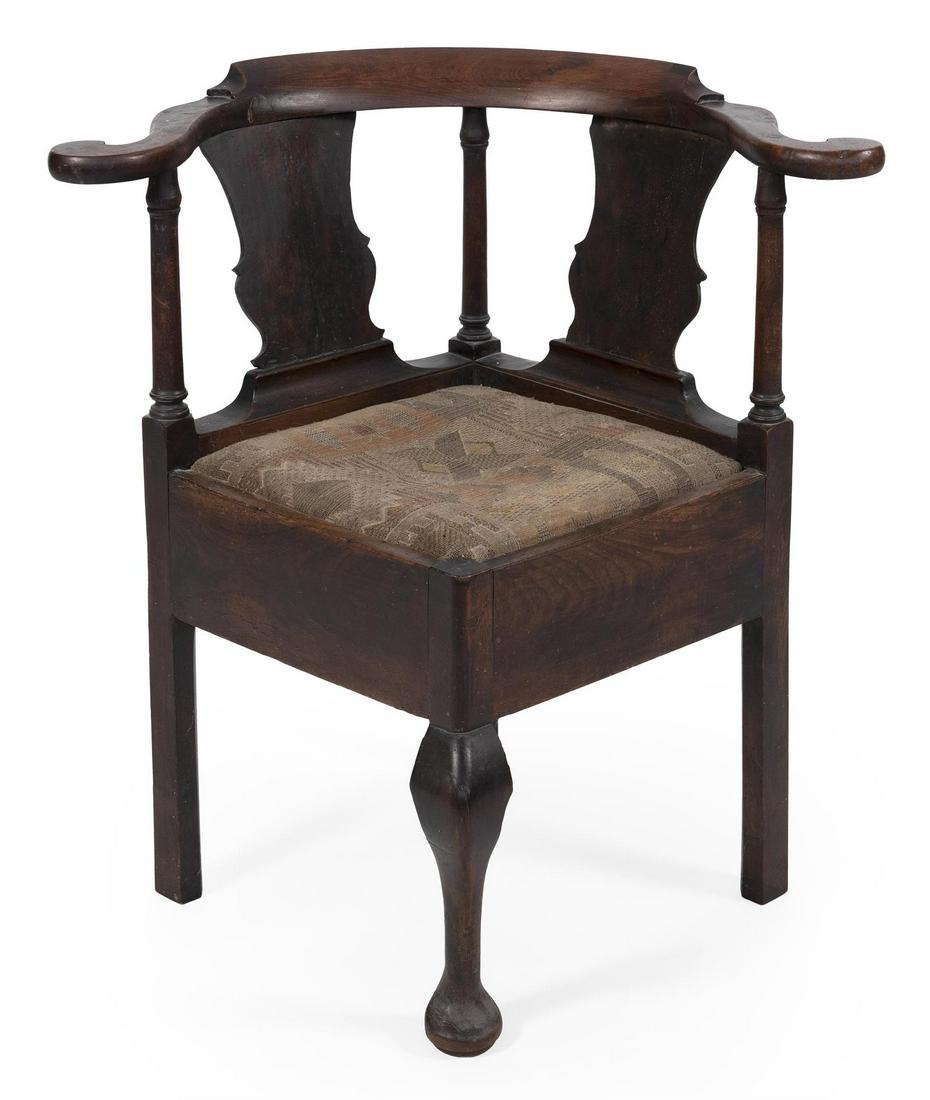 GEORGE II CORNER CHAIR In walnut. Low crest rail and: GEORGE II CORNER CHAIR Mid-18th Century In walnut. Low crest rail and nicely scrolled arms. Solid vasiform splats. Slip seat. Cabriole front legs end in pad feet. Back height 31.5". Seat height 19".