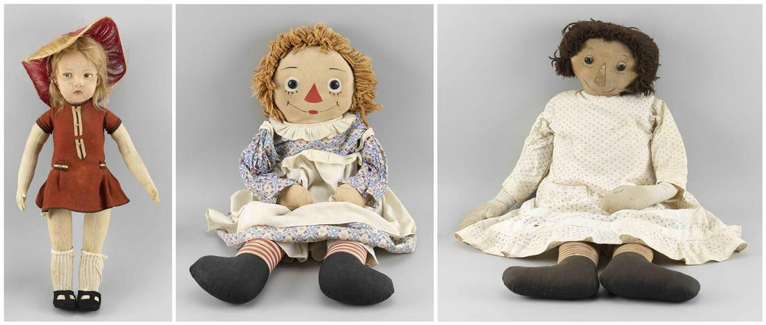 THREE CLOTH DOLLS Two early Raggedy Ann dolls, heights: THREE CLOTH DOLLS Mid-20th Century Two early Raggedy Ann dolls, heights 30" and 36", and a Lenci doll wearing a red dress, height 22".