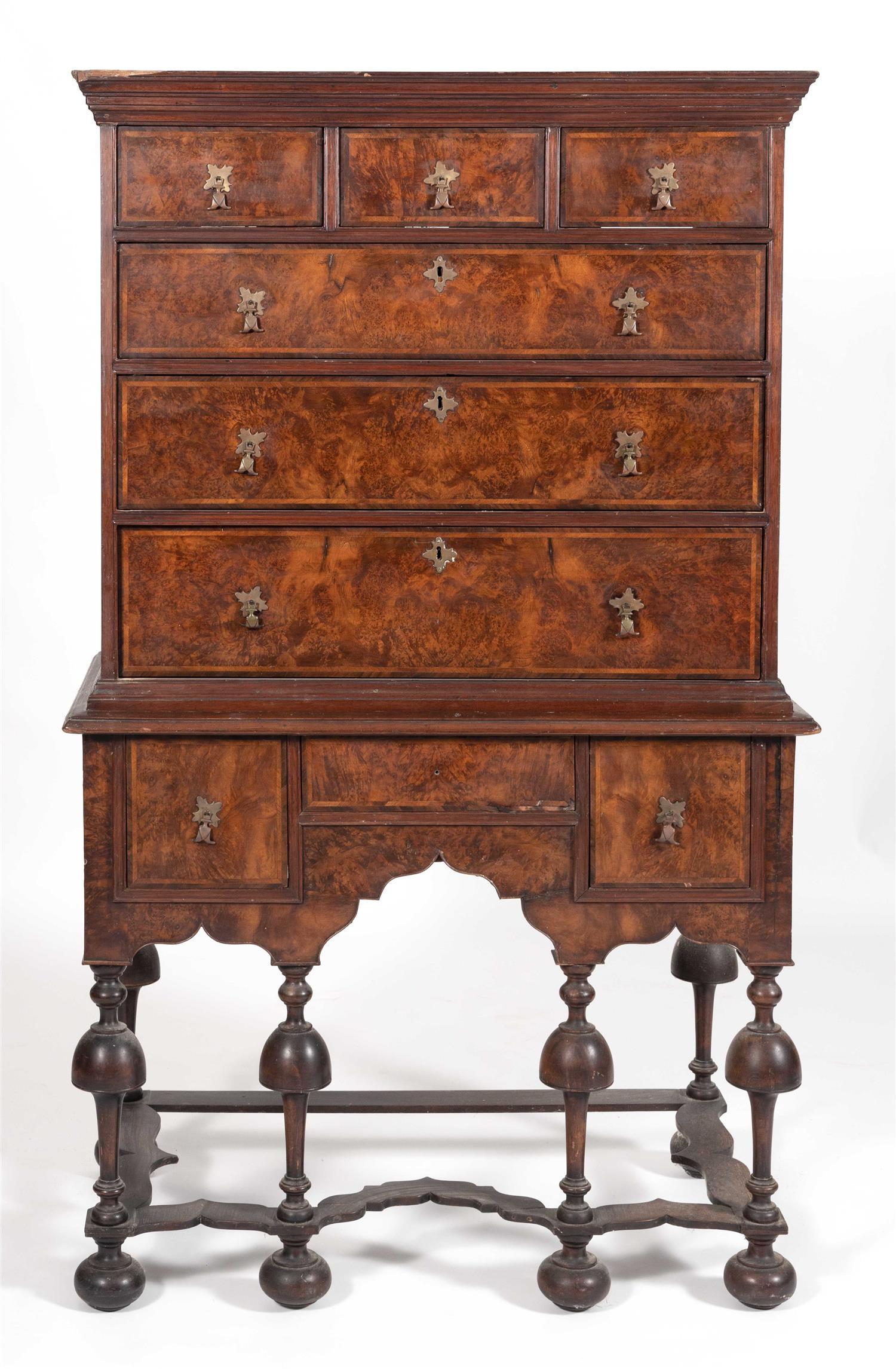 WILLIAM & MARY TWO-PART HIGHBOY In walnut and walnut: WILLIAM & MARY TWO-PART HIGHBOY New England, Early 18th Century In walnut and walnut veneer. Upper case with three side-by-side drawers over three graduated full-width drawers. Lower case with three s