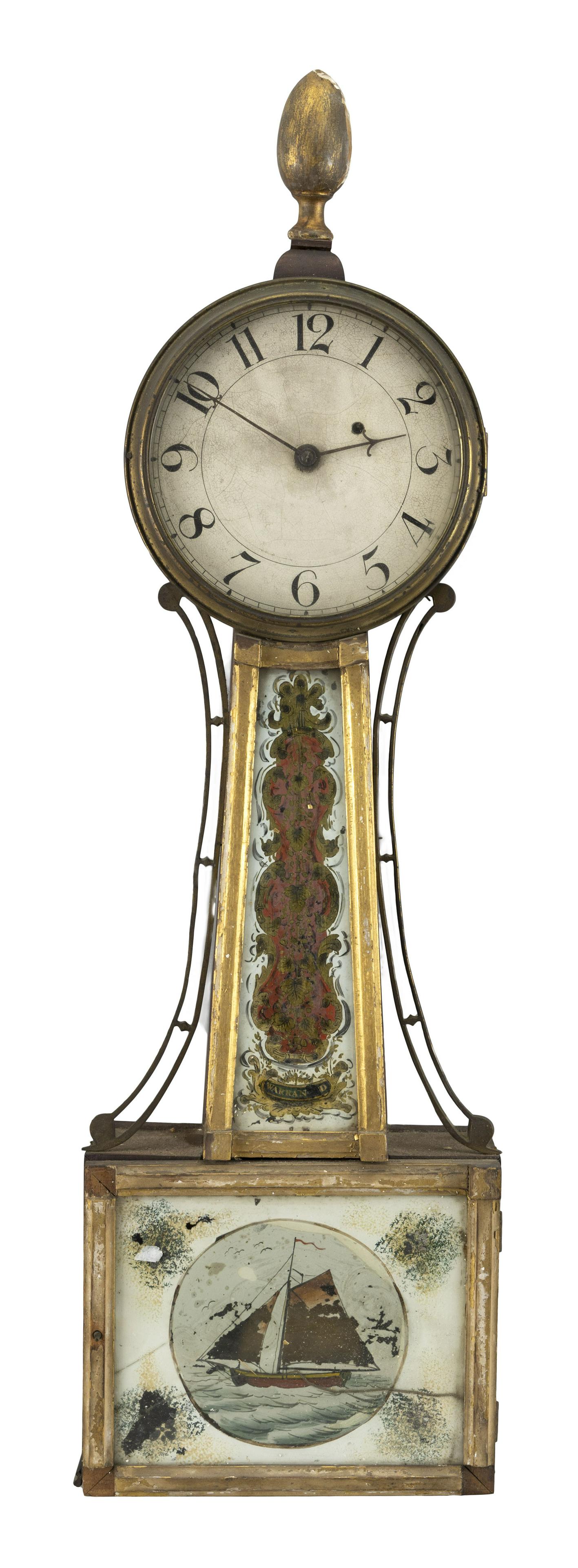 AMERICAN BANJO CLOCK Mahogany case with gilt acorn-form: AMERICAN BANJO CLOCK First Quarter of the 19th Century Mahogany case with gilt acorn-form finial and original reverse-painted throat and door glass. Painted Arabic numeral dial. Height 33.5". Width 10