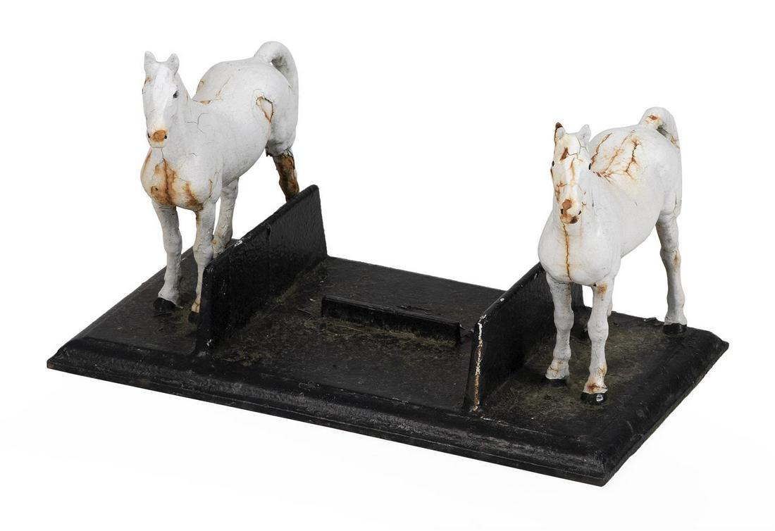 CAST IRON HORSE BOOT SCRAPER ATTRIBUTED TO HUBLEY Two: CAST IRON HORSE BOOT SCRAPER ATTRIBUTED TO HUBLEY America, 19th Century Two white horses on a black base. Stamped "22L" on base. Height 12". Width 20". Depth 20".