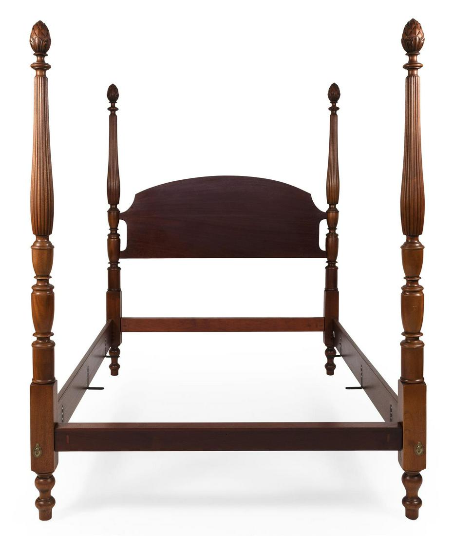SHERATON-STYLE QUEEN-SIZE FOUR-POST BED In mahogany.: SHERATON-STYLE QUEEN-SIZE FOUR-POST BED In mahogany. Turned posts with carved pineapple finials and fluted upper portions. Arched headboard. Total height 80". Height to top of headboard 61". Width bet