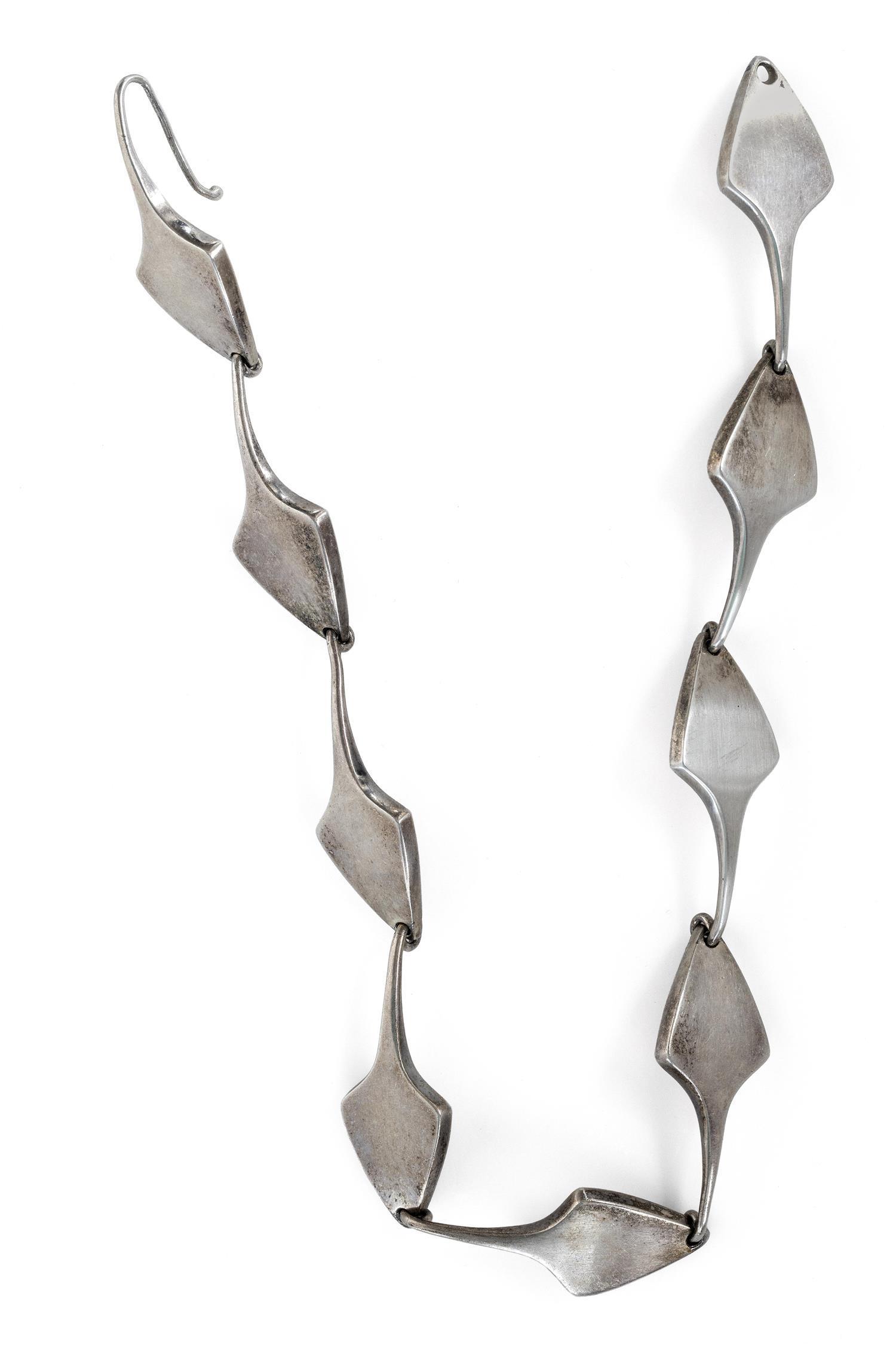 BENT KNUDSEN MODERNIST STERLING SILVER NECKLACE: BENT KNUDSEN MODERNIST STERLING SILVER NECKLACE Denmark, Mid-20th Century Comprised of nine curved spade-form links. Stamped marks and numbered 16. Length 14.5".