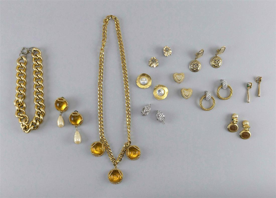 LOT OF VINTAGE COSTUME JEWELRY Circa 1980 1) Pair of: LOT OF VINTAGE COSTUME JEWELRY Circa 1980 1) Pair of Escada rhinestone heart clip-on earrings. 2) Pair of Chanel button drop clip-on earrings. 3) Pair of Norma Jean crystal and brushed gold clip-on ea