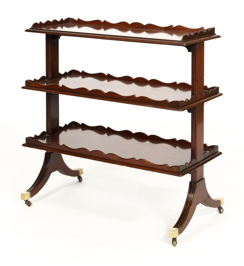 DUNCAN PHYFE-STYLE THREE-TIER SERVER In mahogany and: DUNCAN PHYFE-STYLE THREE-TIER SERVER Early 20th Century In mahogany and mahogany veneer. Each tier with shaped gallery. Splayed legs fitted with brass casters. Height 39.5". Width 37.5". Depth 18".