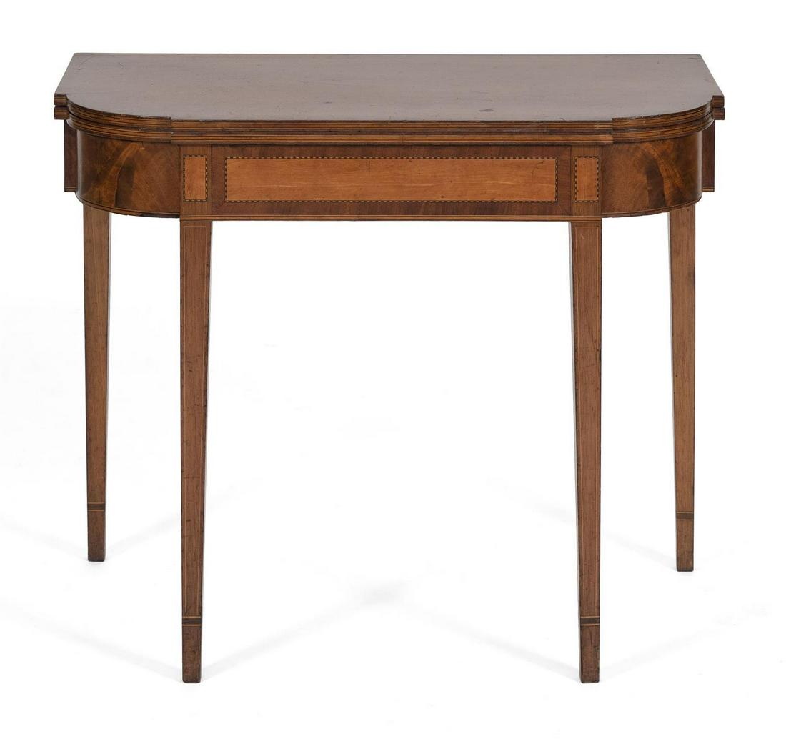 HEPPLEWHITE CARD TABLE In maple and tiger maple. Front: HEPPLEWHITE CARD TABLE America, Circa 1800 In maple and tiger maple. Front of apron with rectangular inlaid birch panels with alternating banded inlay along perimeters. Height 29.5". Width 34.5". Dept