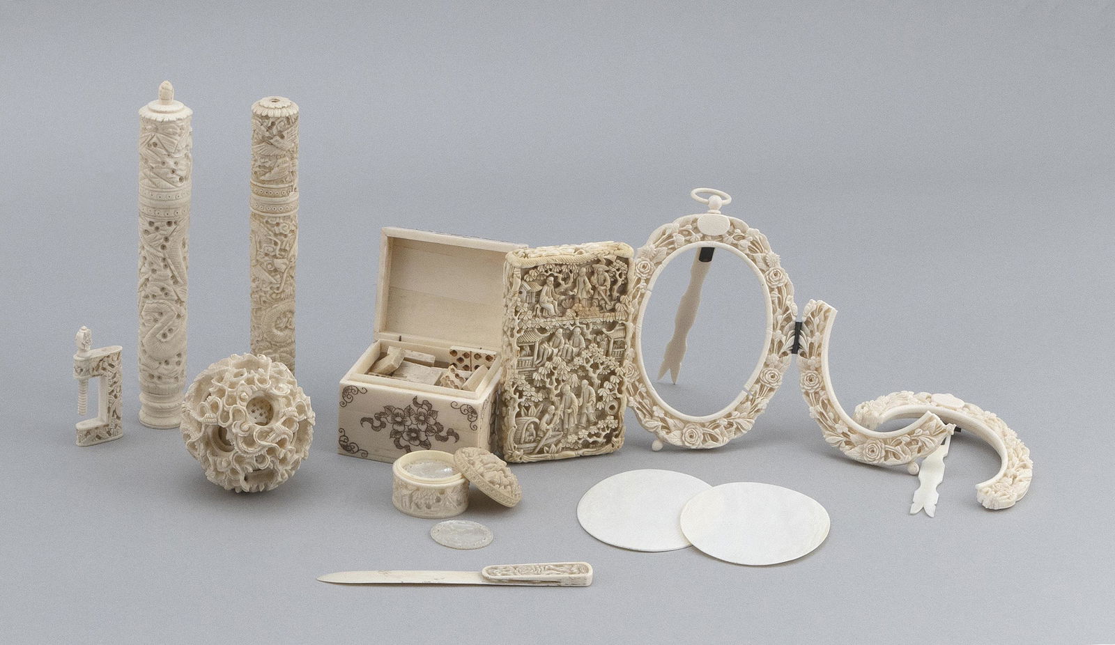 TEN CARVED BONE AND IVORY ITEMS 19th Century: TEN CARVED BONE AND IVORY ITEMS 19th Century Chinese, Chinese Export, etc. Most with figural and floral relief carvings. Includes two cylindrical needle cases, a card case, a page turner, a sewing cla
