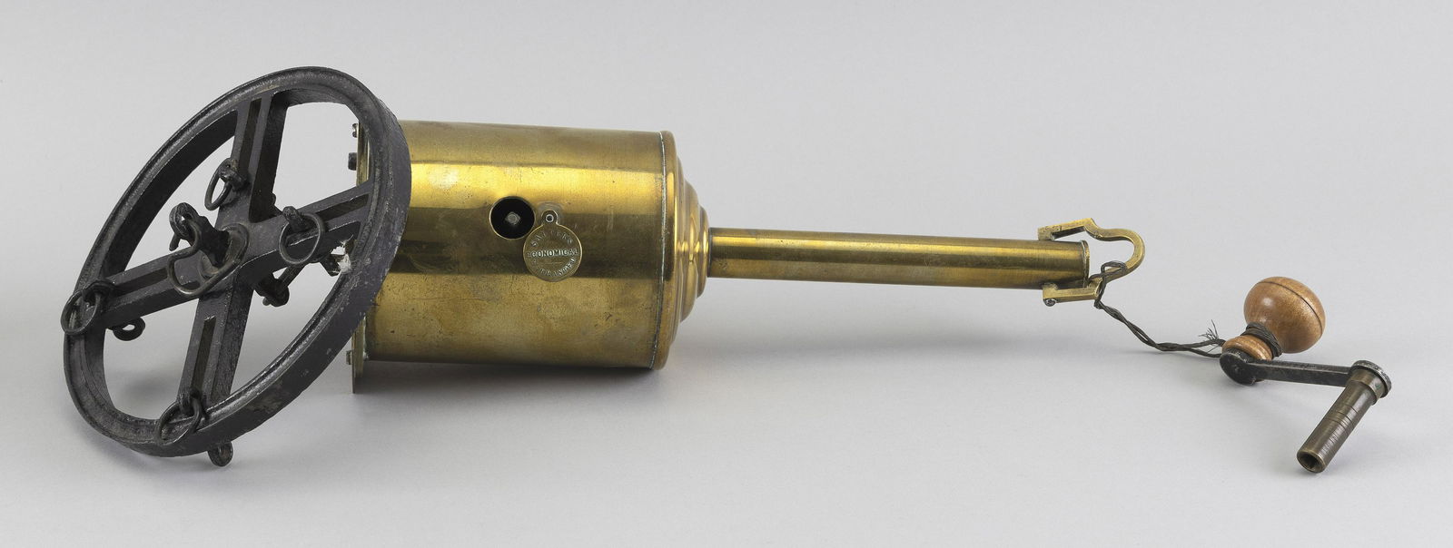 ENGLISH BRASS AND IRON CLOCKWORK ROASTING JACK Mid-19th: ENGLISH BRASS AND IRON CLOCKWORK ROASTING JACKMid-19th CenturyIncludes winding key. Labeled "Salter's Economical Warranted".Length 15.5".