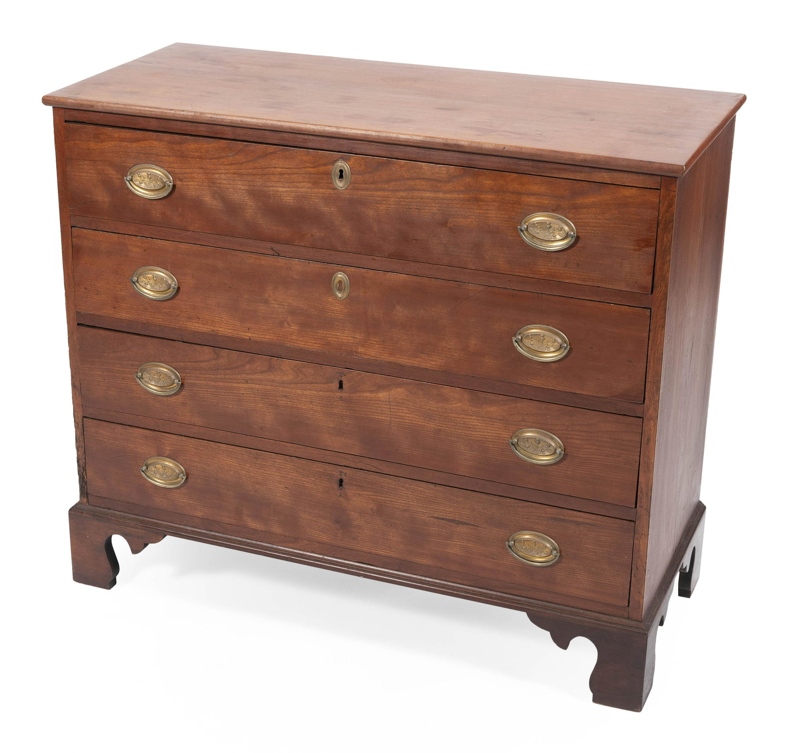 CHIPPENDALE FOUR-DRAWER CHEST America, Circa 1780: CHIPPENDALE FOUR-DRAWER CHEST America, Circa 1780 In cherry, with oval brasses and bracket feet. Height 35.5”. Width 41”. Depth 17.25”.
