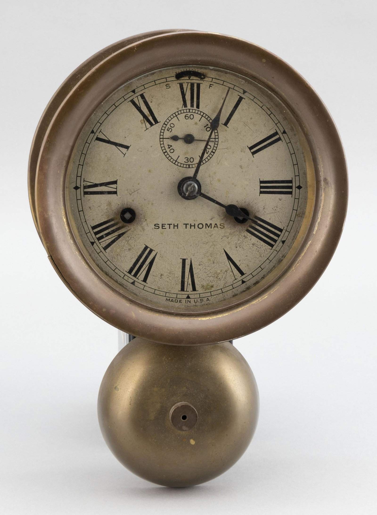 SETH THOMAS BRASS 8-DAY SHIP'S BELL CLOCK Late: SETH THOMAS BRASS 8-DAY SHIP'S BELL CLOCK Late 19th/Early 20th Century Eight-day time and strike movement. Height 10.75”. Crystal diameter 5.5”.