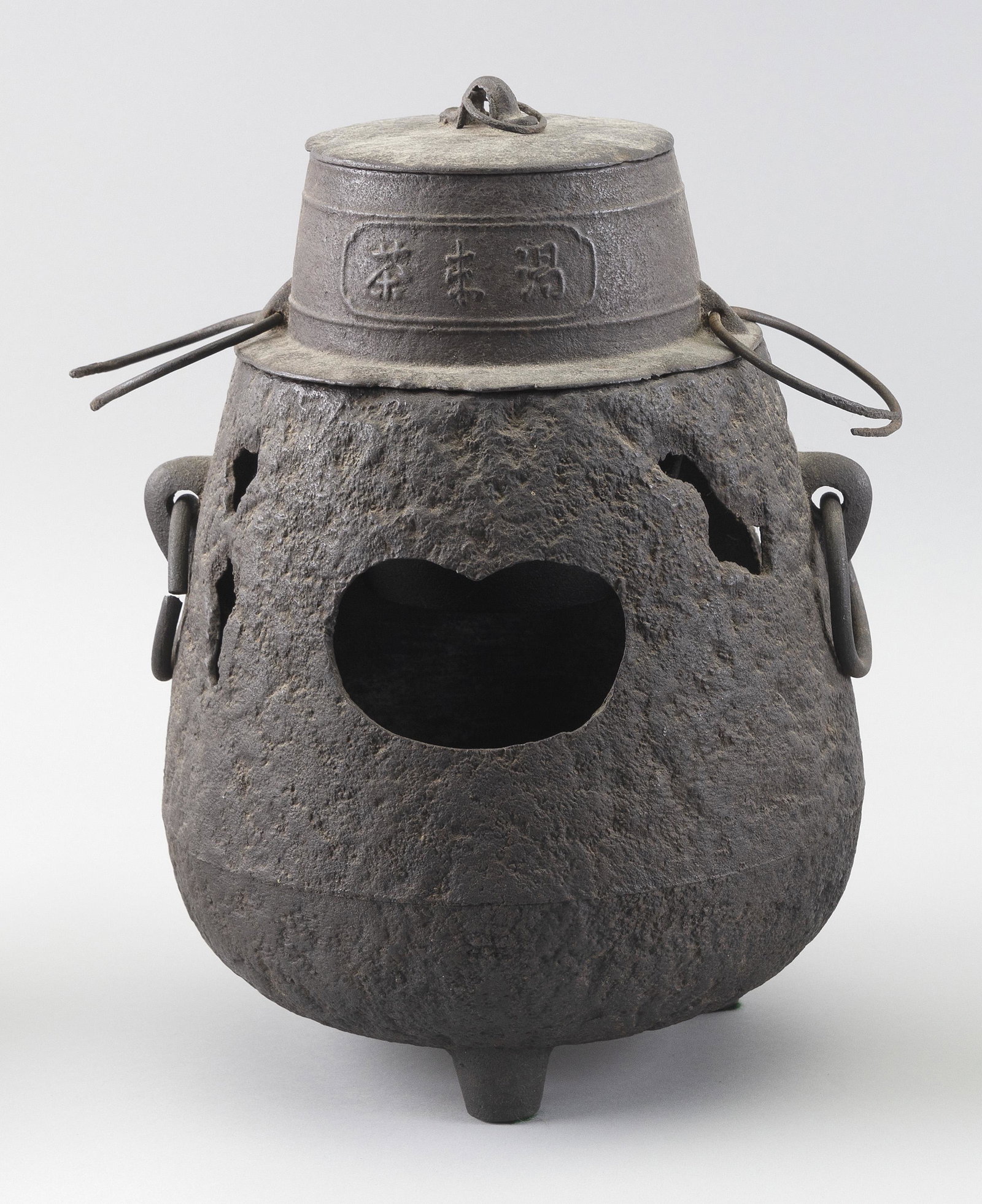 JAPANESE CAST IRON TEA CEREMONY HIBACHI Meiji Period: JAPANESE CAST IRON TEA CEREMONY HIBACHI Meiji Period Ovoid. Separate covered lift-out warmer. Ring handles on each piece. Height 12".
