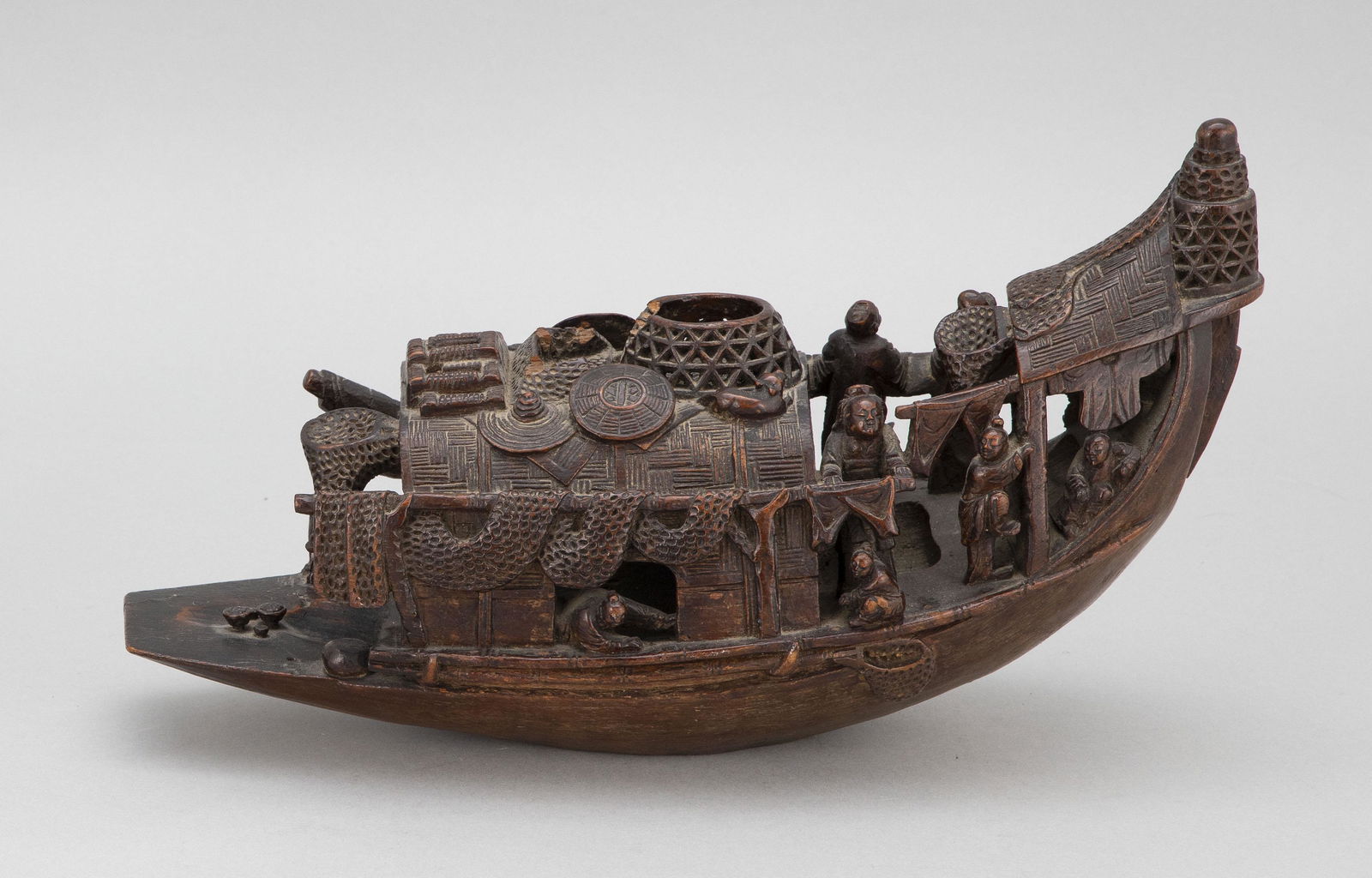 CHINESE CARVED WOOD FISHING BOAT 20th Century Height: CHINESE CARVED WOOD FISHING BOAT20th CenturyWith figures and animals aboard.Height 6". Length 14".