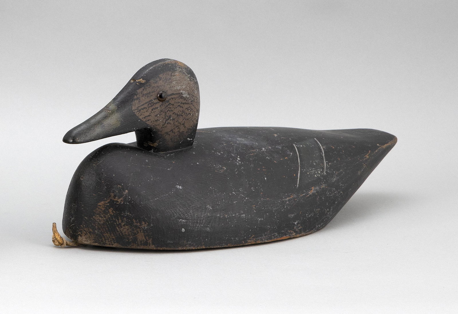 JOE LINCOLN BLACK DUCK DECOY Accord, Massachusetts,: JOE LINCOLN BLACK DUCK DECOY Accord, Massachusetts, 1859-1938 Original paint with gunning wear. Lightly hit by shot. Length 18".