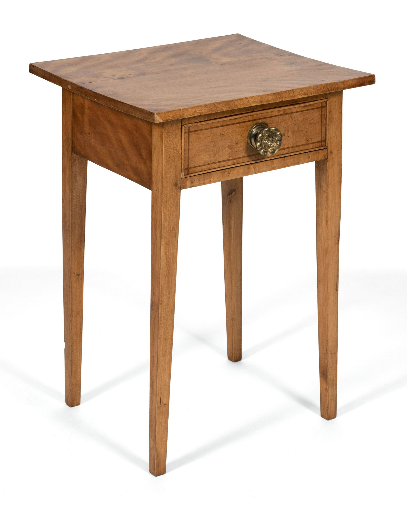 ONE-DRAWER STAND Circa 1810 Height 27.75". Top 19.5" x: ONE-DRAWER STAND Circa 1810 Birch top. Drawer with cock-bead molding, line inlay and an embossed brass pull. Square tapered legs. Height 27.75". Top 19.5" x 16.5". Provenance: The Estate of Sandra L. 