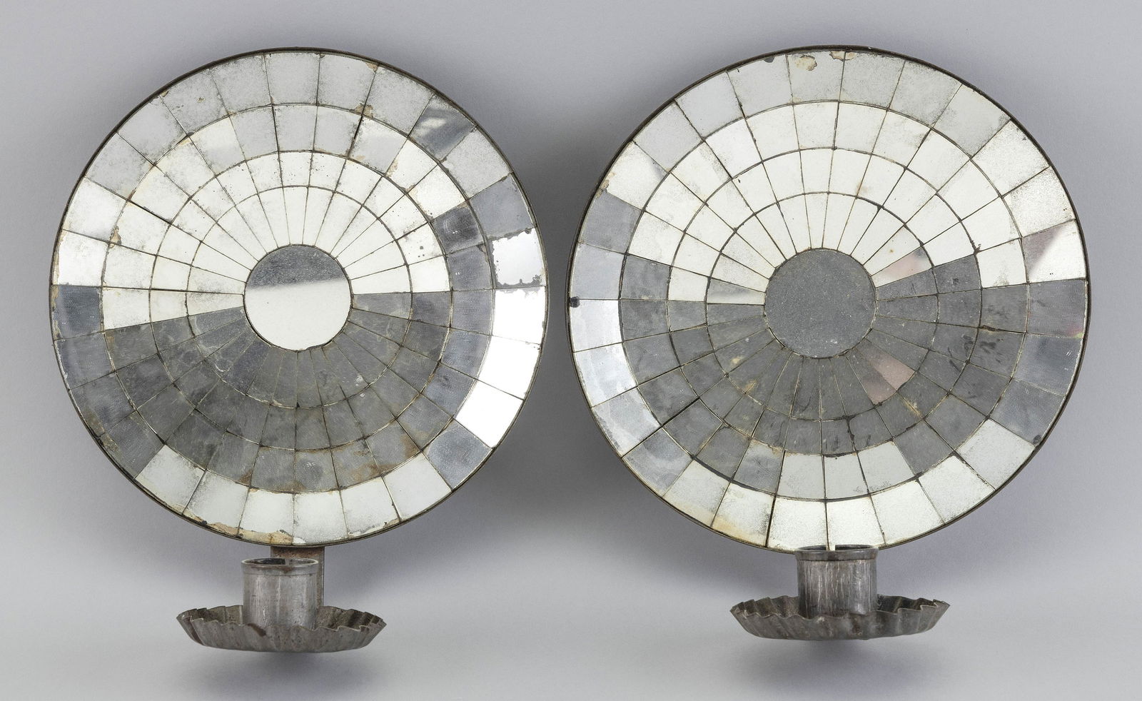 PAIR OF TIN MIRROR-BACK WALL SCONCES First Half of the (1 of 2)