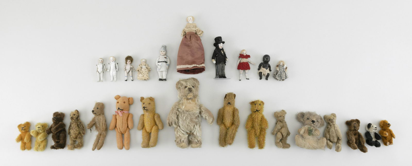 SIXTEEN EARLY SMALL BEARS AND TEN SMALL BISQUE DOLLS (1 of 1)